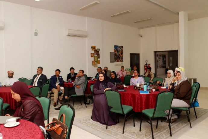 A full room of members at the session